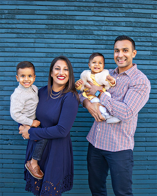 patel family posed with their children