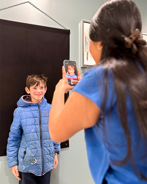 child patient getting their smile photos taken before treatment begins